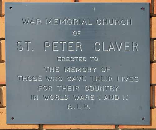 On the west side of the front corner is this memorial plaque.  It reads: ‘War Memorial Church of St Peter Claver, Erected to the memory of those who gave their lives for their country in World Wars I and II  R.I.P.’
