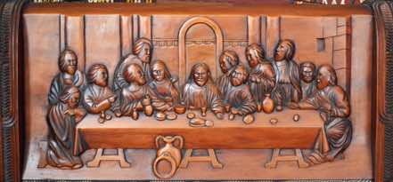 This beautifully carved scene is a distinctly Maori portrayal of the Last Supper.  [Click to ZOOM.]
